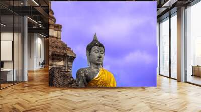 Ancient Buddha statues and pagodas which has a blue sky background Wall mural