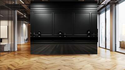 A dark room with wood floor and black wall panels, lit by two spotlights, with vases on a shelf. Wall mural