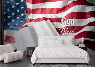 Open Holy bible and Wooden cross over American flag background. God bless America. Wall mural