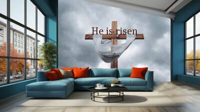 Wood cross on grey sky background with copy space for inscription. Good Friday, He is risen concept. Wall mural