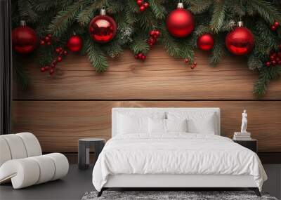 Christmas border, holiday background. Christmas border on wooden background with red ornaments and fir branches  Wall mural