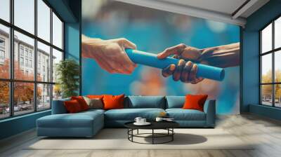 Passing the Relay Baton. Close-up of two hands passing the baton in a track and field race, A blurred background of a sports stadium Wall mural