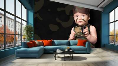 baby soldier in uniform with war paint on his face. Boy in unifo Wall mural