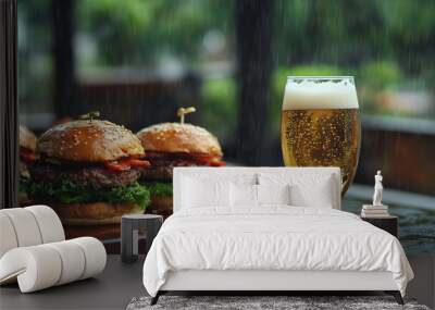 Delicious burgers and a refreshing beer on a rainy day at an outdoor eatery Wall mural