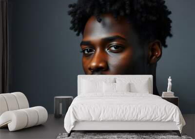 black African man fashion model, close-up face, studio background, gray background, curly hair Wall mural