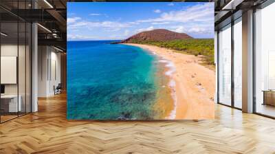 A huge sandy beach. Green hill between blue sea and sky. Amazing waves on the sand. Makena beach, Maui, Hawaii Wall mural