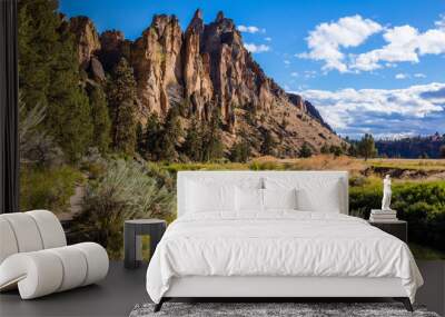 The river is flowing among the rocks. Colorful Canyon. Reflection of the yellow rocks in the river. Amazing landscape of yellow sharp cliffs. Smith Rock state park, Oregon Wall mural