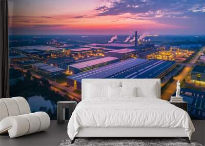 A bird's-eye view of an industrial park at sunset, with smokestacks and vibrant skies. Wall mural