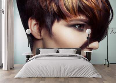 Fashion portrait of a beautiful girl with colored dyed hair, professional short hair coloring. studio shot. Wall mural