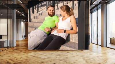 Runner couple resting. Wall mural