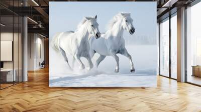 Two white horses galloping together on a snow-covered field on a background of a winter forest Wall mural