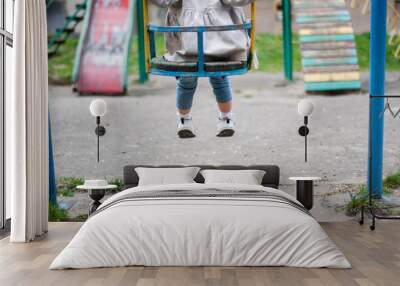 Child on the neglected playground Wall mural