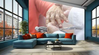 Doctor hand with stethoscope check up elderly woman people. Old aging female seeing medical physician in clinical healthcare hospital. Wall mural