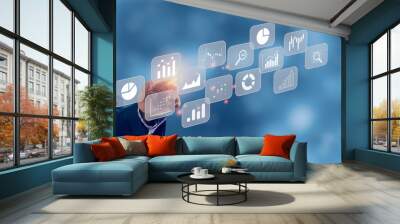 Big data analytics BI intelligence business concept with chart and graph icons on virtual screen interface and a businessman in background. Wall mural