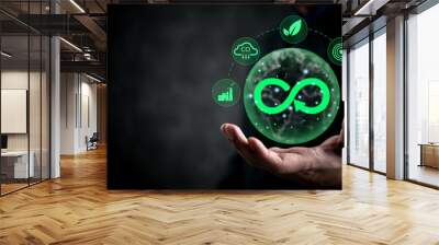 Businessman holding a green sustainability icon representing circular economy, eco-friendliness, and corporate responsibility. Ideal for ESG reports, green energy promotions Wall mural