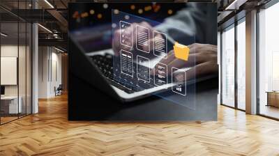 Businessman working online data and document system on laptop with virtual screen. Online database and document management system and keep in security folder concept. Wall mural