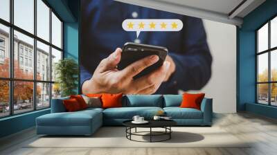 Customer service concept excellent service for satisfaction five star rating with business man holding smart phone. Wall mural