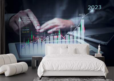 financial charts and graph analysis marketing showing growing revenue In 2023 floating above digital screen tablet, business about strategy for growth and success.Investing in stock markets funds. Wall mural