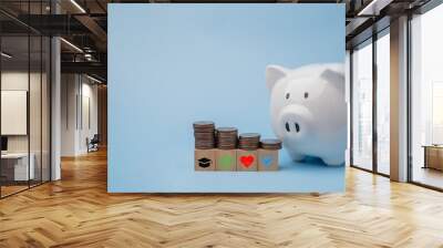 piggy bank and coins stacking with icon saving energy and money on cube wood . business finance and banking investment, tax, insurance home and car concept. Wall mural