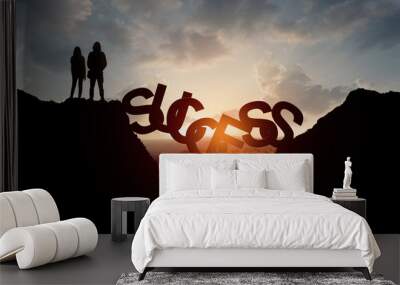 Man and Women about to stay over precipice on SUCCESS word bridge Wall mural