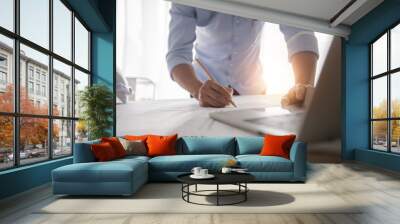 Architect working in office with blueprints,engineer thinking and planning inspection in workplace for architectural plan,sketching a construction project,Business construction concept. Wall mural