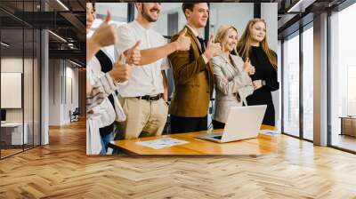 Motivated successful business team, group of business people  show thumb up Wall mural