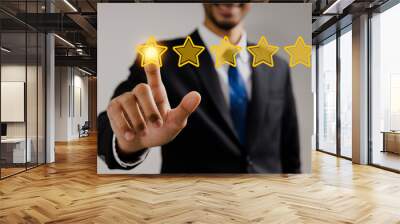 review rating and feedback, the best and excellent admire by reviewer, close up on finger  of businessman touch on gold 5 stars Wall mural