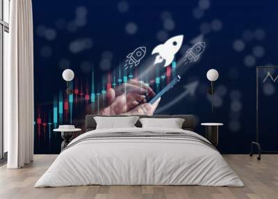 Businessman hold smart phone with rocket launch investment growth, planning and staring corporate business start up aiming objective value development leadership and customer target group. Wall mural