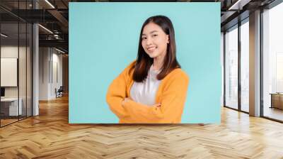 Dental of young asian woman wearing retainer braces glad emotion with white teeth increase confidence for healthy on blue background isolated, Happiness teenager smiling facial expression. Wall mural