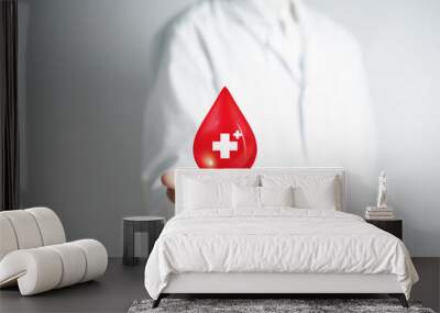 Doctor in a white coat receive blood donation, blood transfusion, world blood donor day, red cross to give blood.world hemophilia day concept. Wall mural