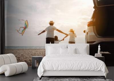 Family happy traveling enjoy in vacation with Car travel driving road trip summer vacation in car in the sunset, Dad, mom and daughter  holidays and relaxation together get the atmosphere. Wall mural