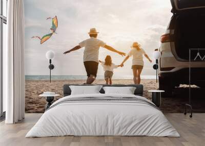 Family happy traveling enjoy in vacation with Car travel driving road trip summer vacation in car in the sunset, Dad, mom and daughter  holidays and relaxation together get the atmosphere. Wall mural