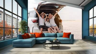 Family happy traveling enjoy in vacation with Car travel driving road trip summer vacation in car in the sunset, Dad, mom and daughter  holidays and relaxation together get the atmosphere. Wall mural