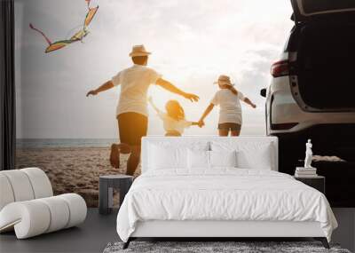 Happy Family with car travel road trip. summer vacation in car in the sunset, Dad, mom and daughter happy traveling enjoy together driving in holidays, people lifestyle ride by automobile. Wall mural