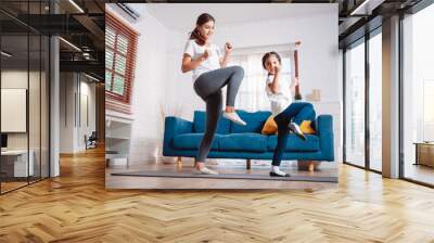 Mother and daughter exercising together happily at home. for flexibility build muscle strength, Sport workout training family together concept. Wall mural