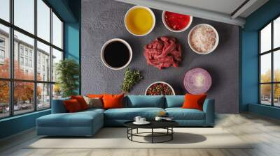 sliced raw beef and ingredients Wall mural