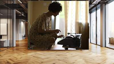 girl typing on a typewriter Wall mural