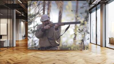 man goes hunting forest summer / landscape in the forest, huntsman with a hunting rifle hunts Wall mural