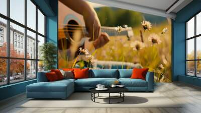 melody is the music of summer, a guy plays the guitar among a summer meadow and grass in a soft color summer background Wall mural