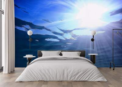 ocean water blue background underwater rays sun / abstract blue background nature water Wall mural