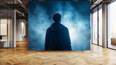 silhouette of a guy, a man view from the back against a background of blue fog and rays of light, a fictional character computer graphics Wall mural