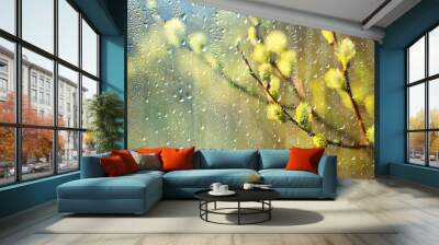 spring rain in the forest, fresh branches of a bud and young leaves with raindrops Wall mural