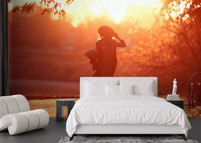 sun sunset silhouette hat girl / model in a summer evening dress, silhouette in the sunshine a beautiful full-length model Wall mural