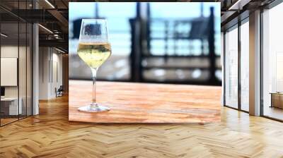 white wine tasting, chilled ice wine in a cold glass in summer Wall mural