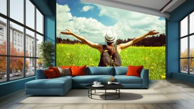 Girl relaxing in a field enjoying nature.
 Wall mural