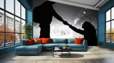 Giving a helping hand. Man giving sad woman help off the street showing kindness and compassion  Wall mural