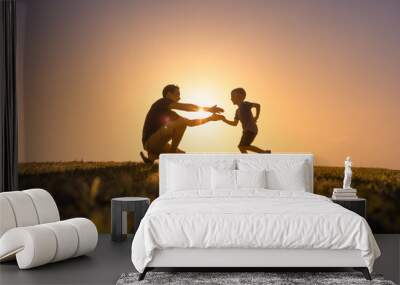 Happy father playing with his son giving him hug. Father son relationship concept	 Wall mural