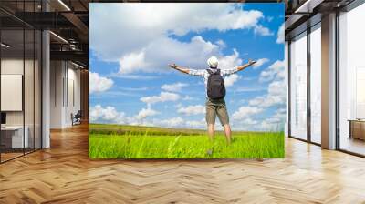 Happy man outdoors in nature  enjoying a beautiful summer day  Wall mural