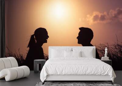 Happy young man and woman sitting in the park. People relationships and love concept. Wall mural