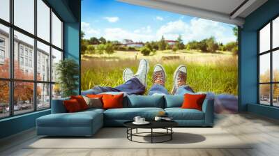 love and relationships. couples feet relaxing in a park on a sunny summer day. Wall mural